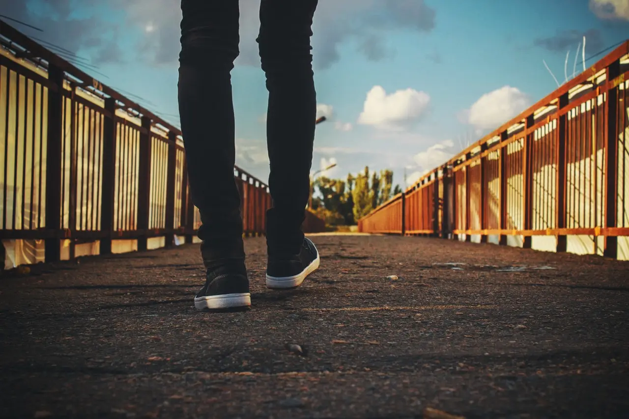 Man walking forward wearing sneakers